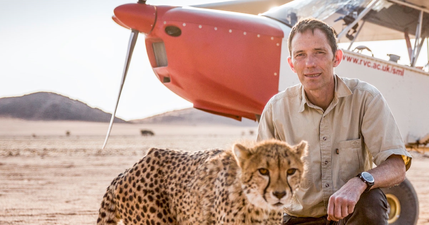 Professor Alan Wilson with a cheetah