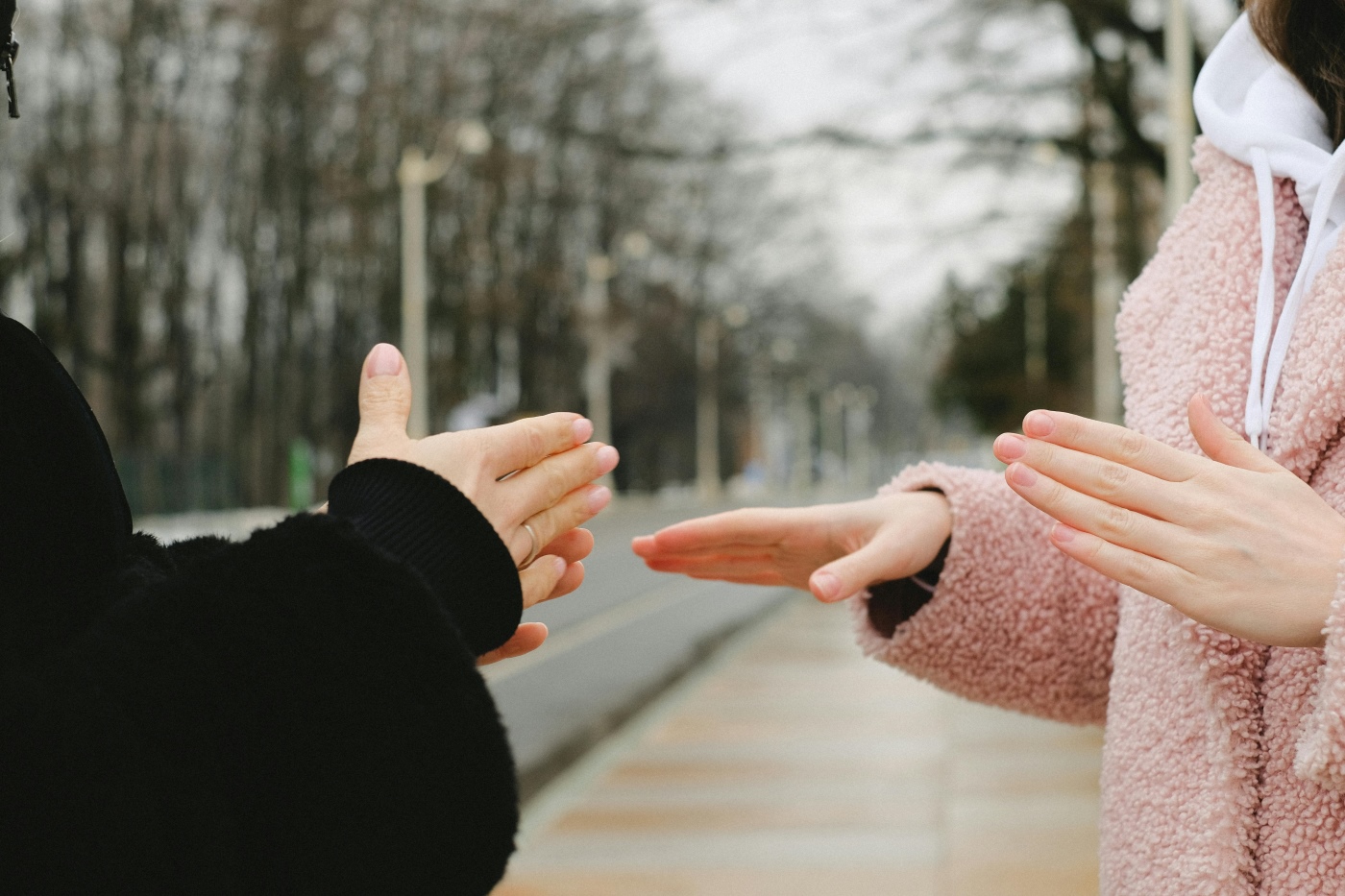 Deaf mute people talking in winter park